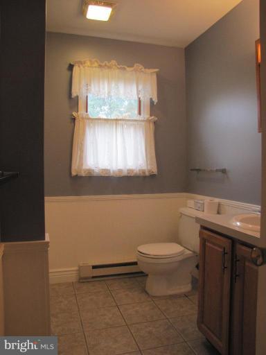 13046 Independence Road Clear Spring, MD 21722 - Photo 16 of 26 a bathroom with a toilet a sink and a window