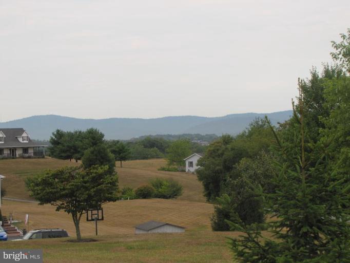13046 Independence Road Clear Spring, MD 21722 - Photo 19 of 26 a view of a lake with a mountain in the background