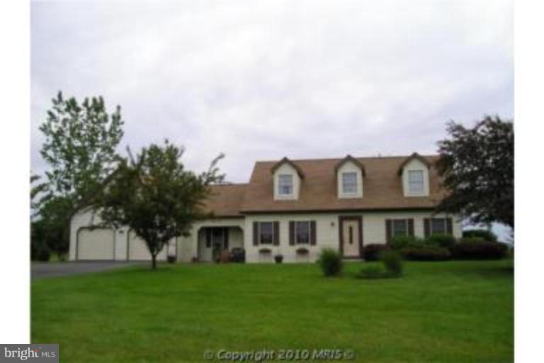 13046 Independence Road Clear Spring, MD 21722 - Photo 3 of 26 a front view of a house with a garden
