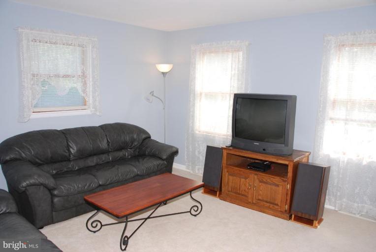 13046 Independence Road Clear Spring, MD 21722 - Photo 23 of 26 a living room with furniture and a flat screen tv