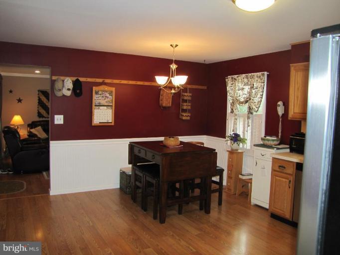 13046 Independence Road Clear Spring, MD 21722 - Photo 6 of 26 a view of a dining room with furniture and chandelier