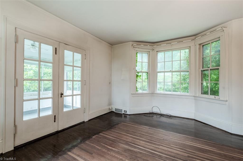 124 Hawthorne Road Elkin, NC 28621 - Photo 11 of 42 Living room looking toward French doors that lead to sunporch.