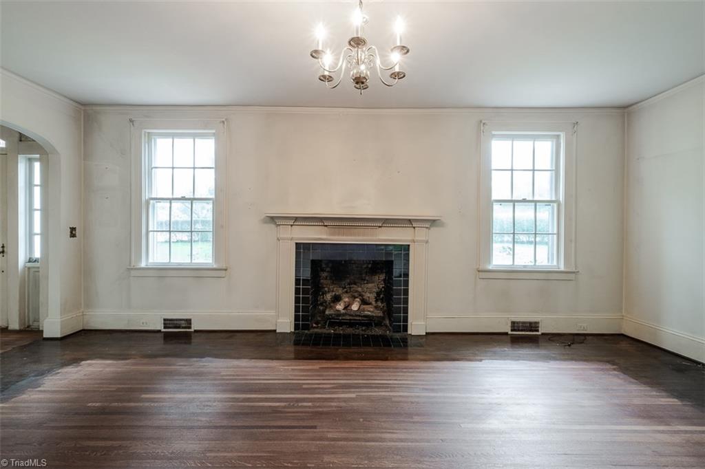 124 Hawthorne Road Elkin, NC 28621 - Photo 13 of 42 Living room features bay window and French doors leading to sunporch.