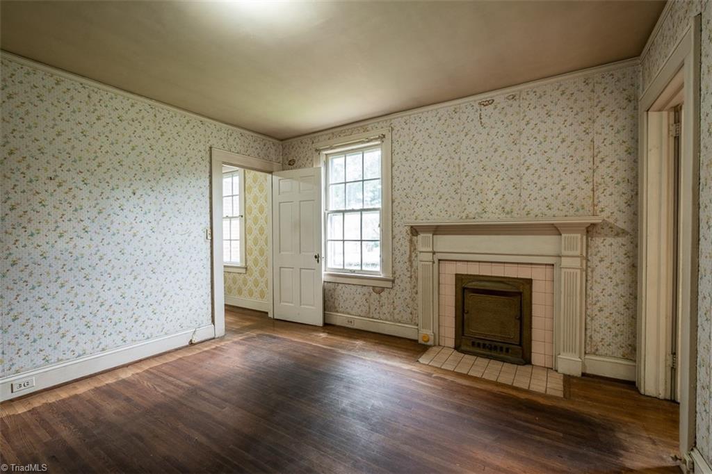 124 Hawthorne Road Elkin, NC 28621 - Photo 24 of 42 Primary bedroom located on second level. Door to left leads to additional room ideal for office, studio, nursery or closet.