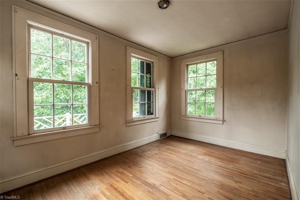 124 Hawthorne Road Elkin, NC 28621 - Photo 26 of 42 Primary bedroom features fireplace.