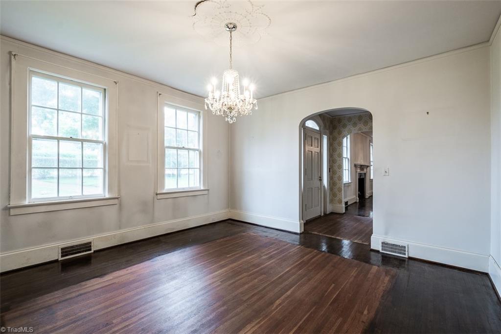 124 Hawthorne Road Elkin, NC 28621 - Photo 9 of 42 Dining room features hardwood floors and leads to breakfast room/kitchen.