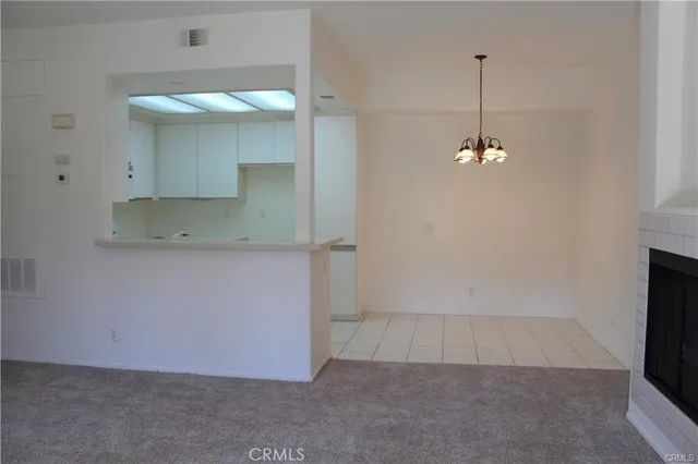 an empty room with a mirror