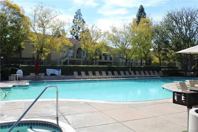 a view of a swimming pool with a patio