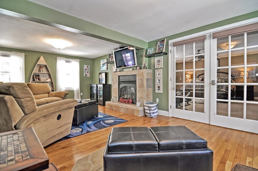 200 Mattapoisett Road Rochester, MA 02770 - Photo 9 of 42 a living room with fireplace furniture and a large window