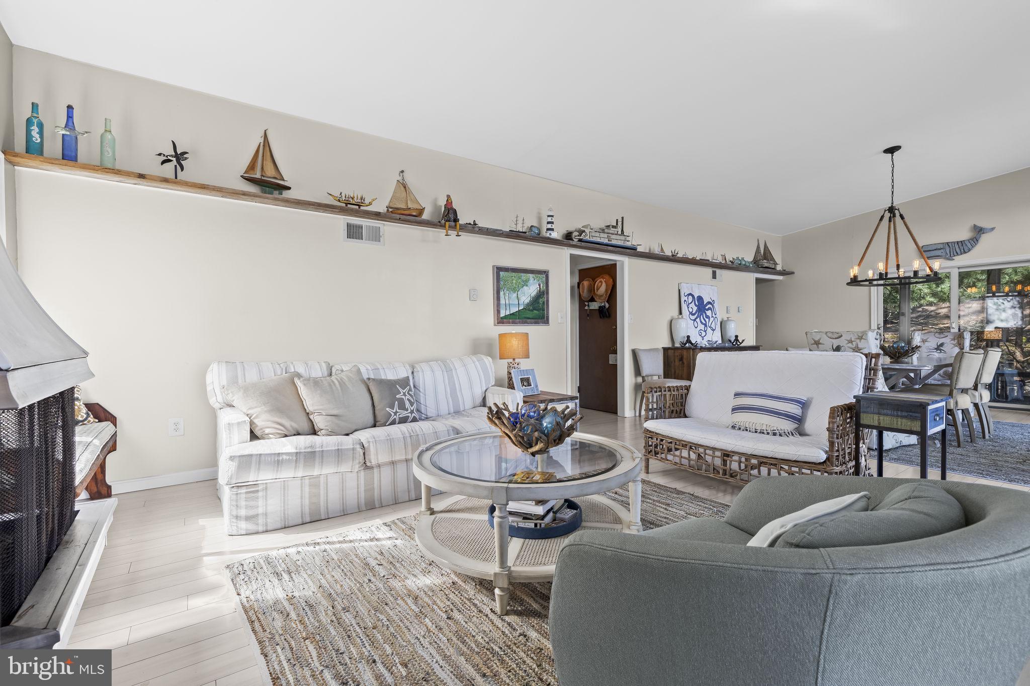 1928 Elm Road Port Republic, MD 20676 - Photo 11 of 48 a living room with furniture and a flat screen tv