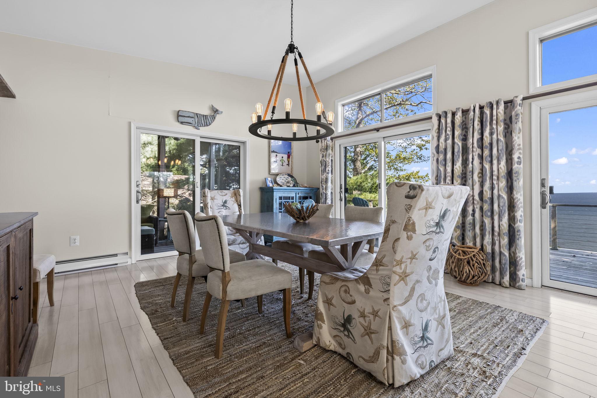 1928 Elm Road Port Republic, MD 20676 - Photo 16 of 48 a dining room with furniture window wooden floor