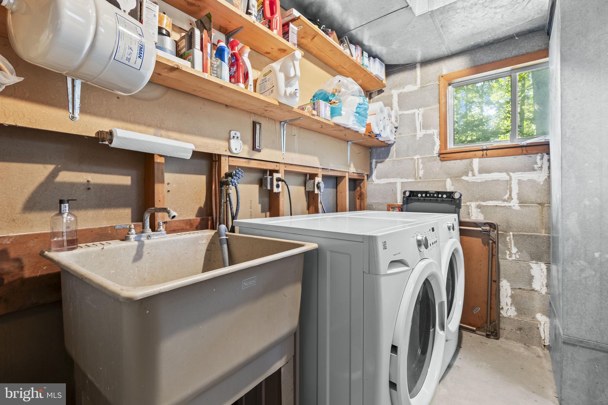 1928 Elm Road Port Republic, MD 20676 - Photo 28 of 48 a view of a kitchen with a sink and a washer dryer