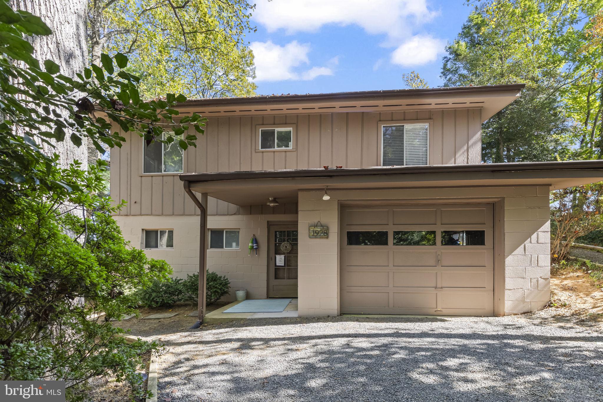 1928 Elm Road Port Republic, MD 20676 - Photo 3 of 48 a house that has a tree in front of the house