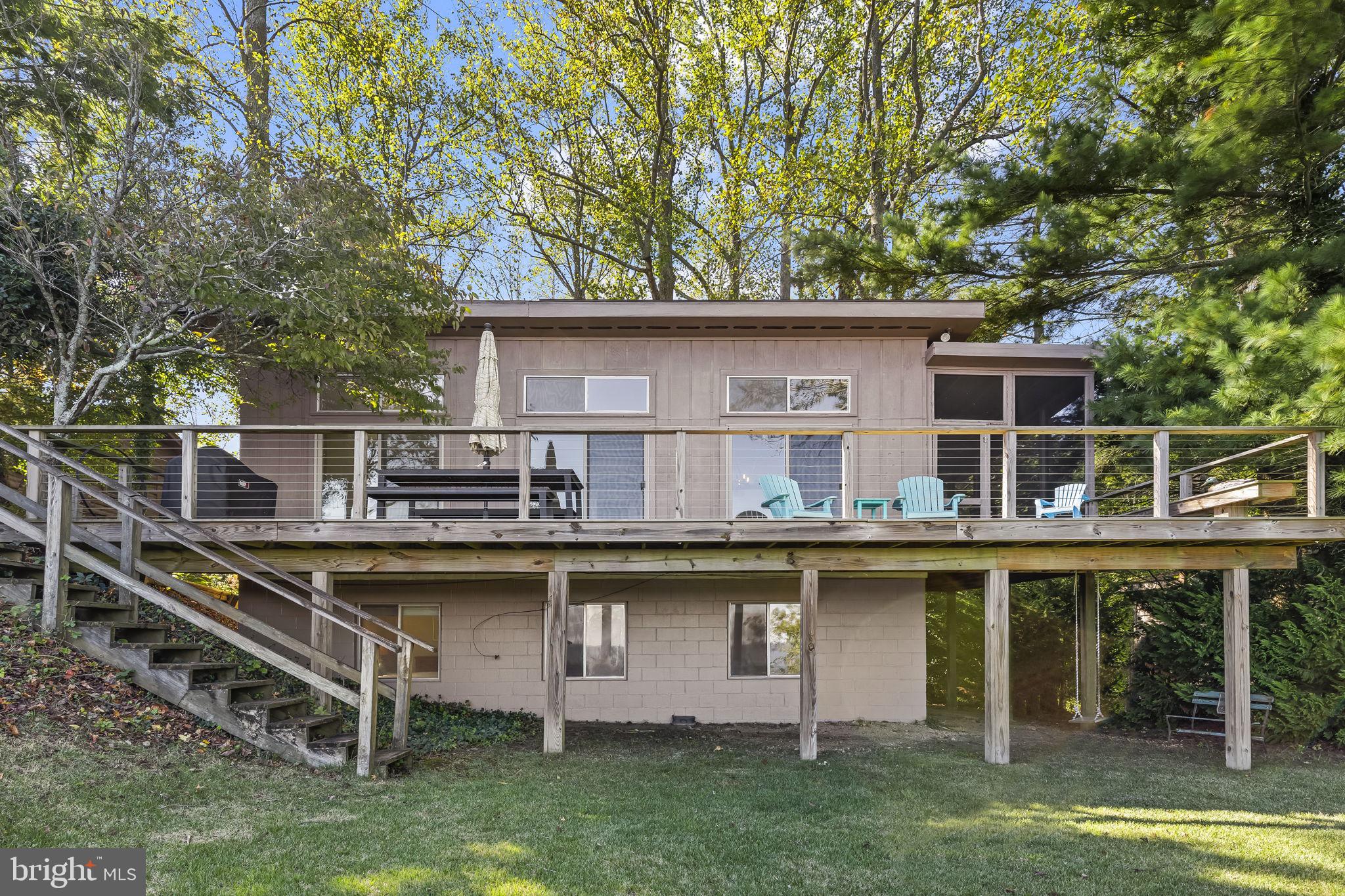 1928 Elm Road Port Republic, MD 20676 - Photo 34 of 48 a view of a house with a wooden deck and a trees