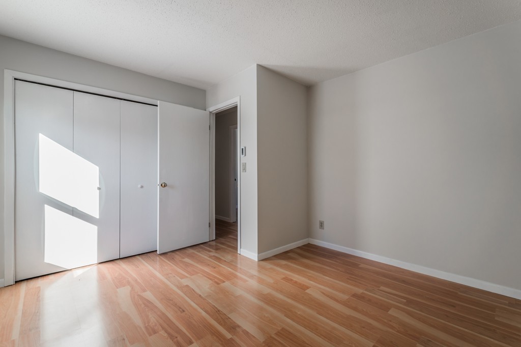16 Prentice Street Springfield, MA 01104 - Photo 11 of 17 a view of an empty room with wooden floor and a window