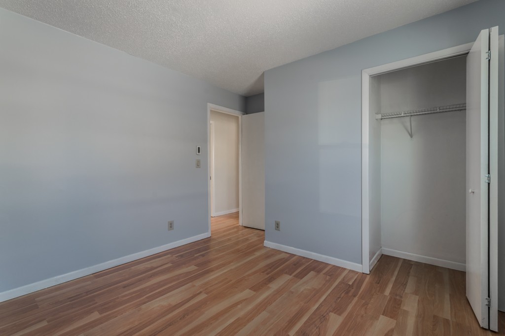 16 Prentice Street Springfield, MA 01104 - Photo 16 of 17 a view of an empty room with wooden floor and a window