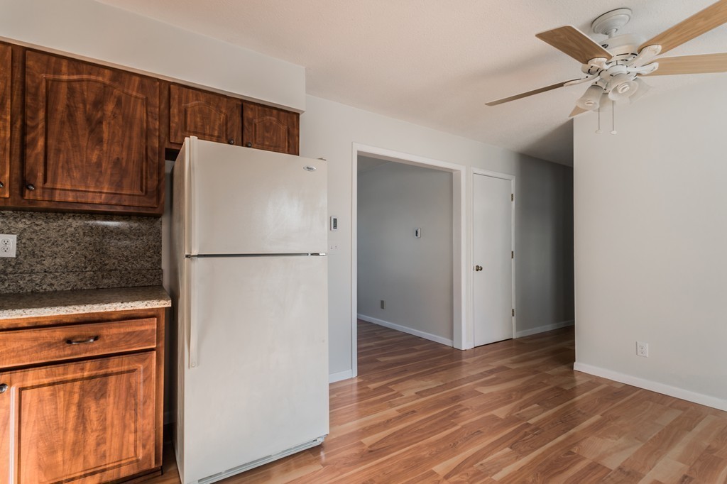 16 Prentice Street Springfield, MA 01104 - Photo 4 of 17 a white refrigerator freezer sitting in a kitchen