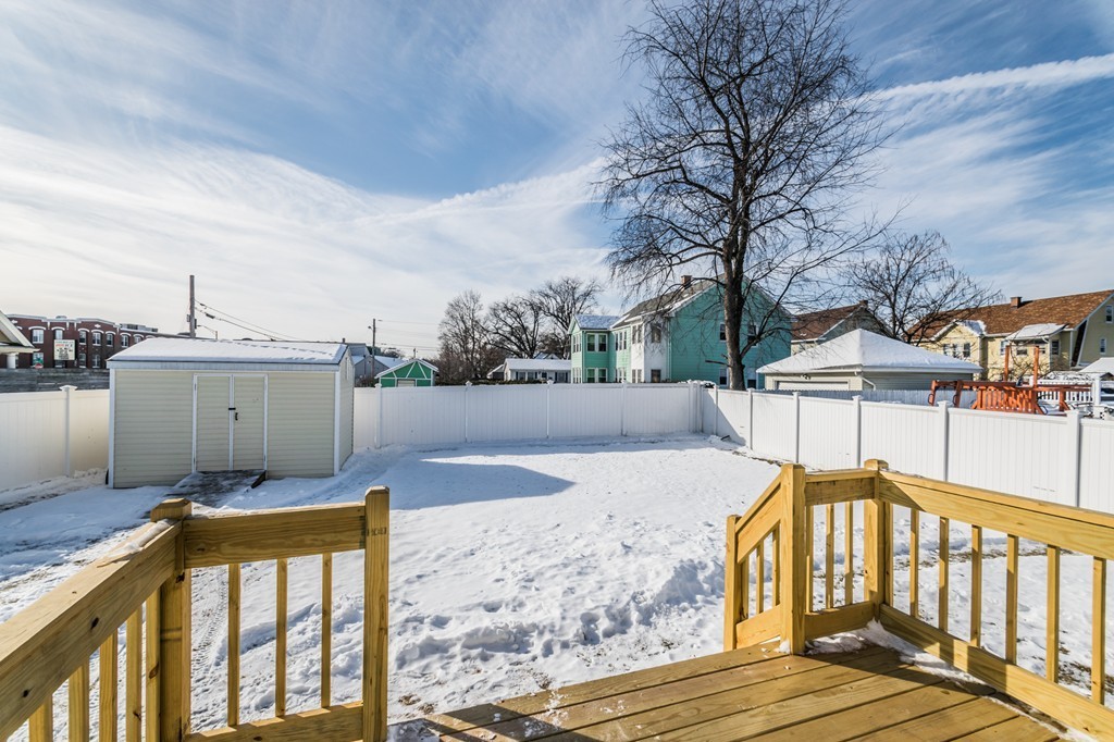 16 Prentice Street Springfield, MA 01104 - Photo 5 of 17 a view of a house with wooden floor next to a yard