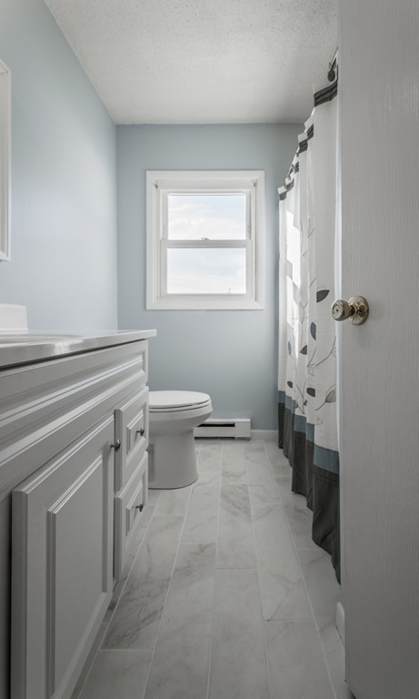16 Prentice Street Springfield, MA 01104 - Photo 6 of 17 a bathroom with a toilet sink and granite