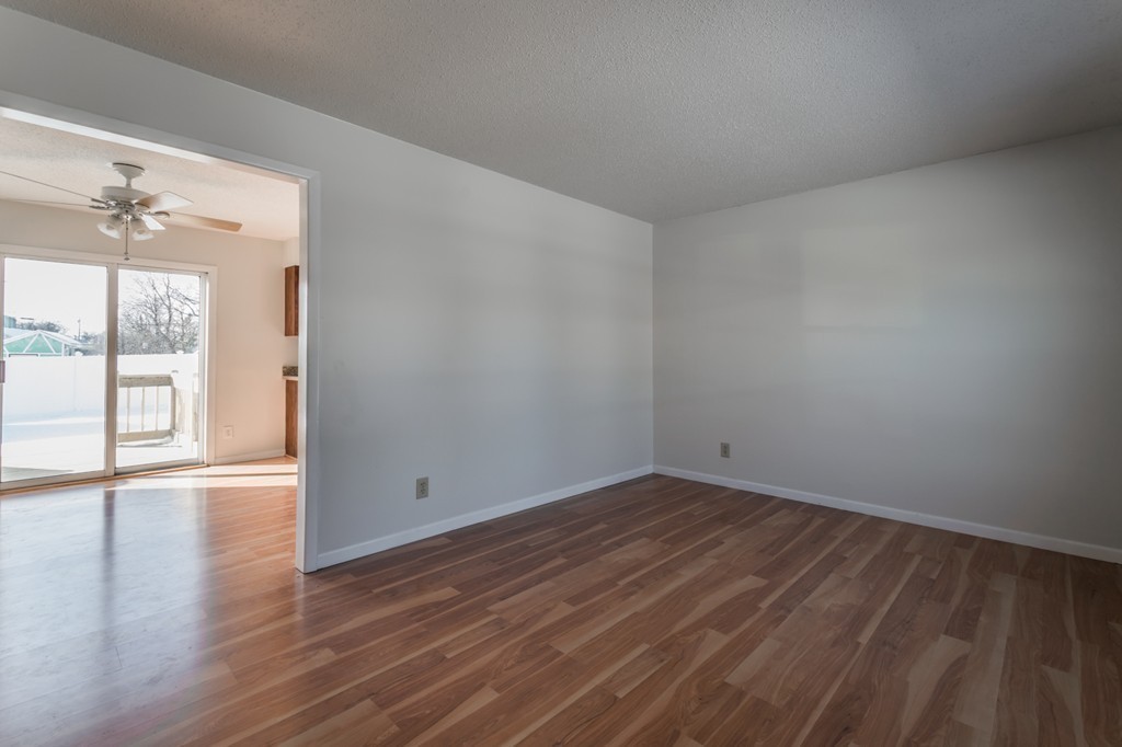 16 Prentice Street Springfield, MA 01104 - Photo 9 of 17 a view of an empty room with wooden floor and a window