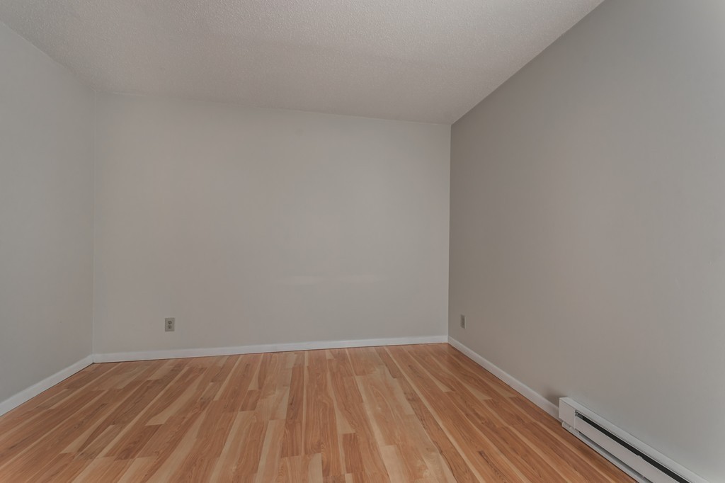 16 Prentice Street Springfield, MA 01104 - Photo 10 of 17 a view of an empty room with wooden floor