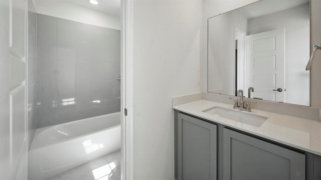 1301 Rusted Rail Drive Princeton, TX 75407 - Photo 6 of 38 Bathroom with vanity and a bath