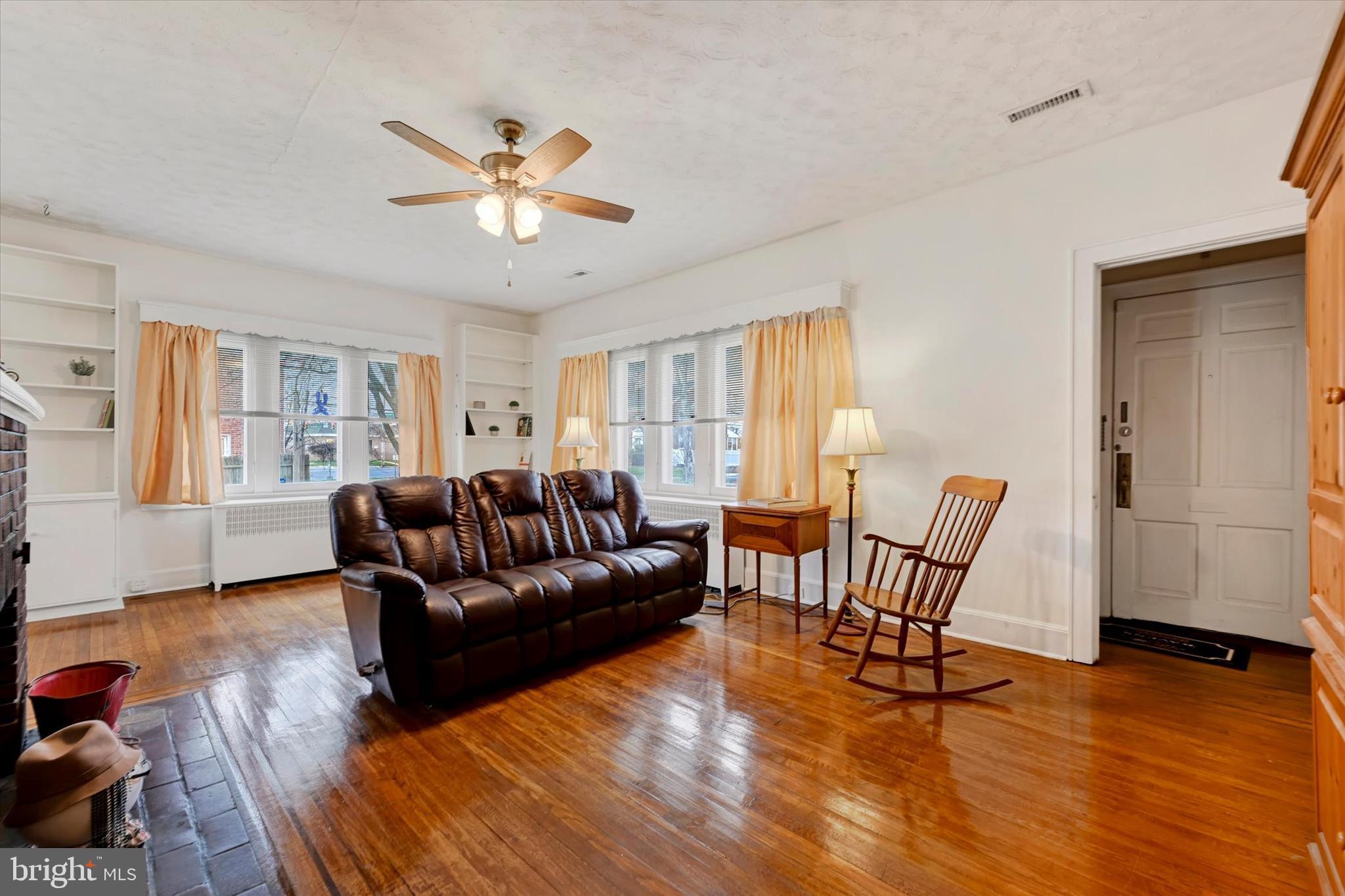 5 Liberty Parkway Baltimore, MD 21222 - Photo 11 of 31 a living room with furniture and a wooden floor