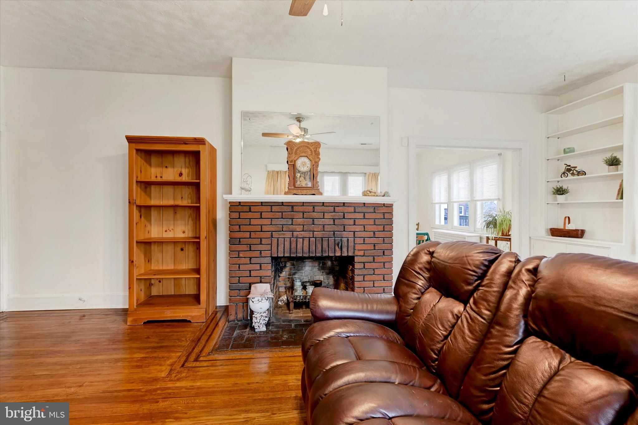 5 Liberty Parkway Baltimore, MD 21222 - Photo 12 of 31 a living room with furniture and a fireplace