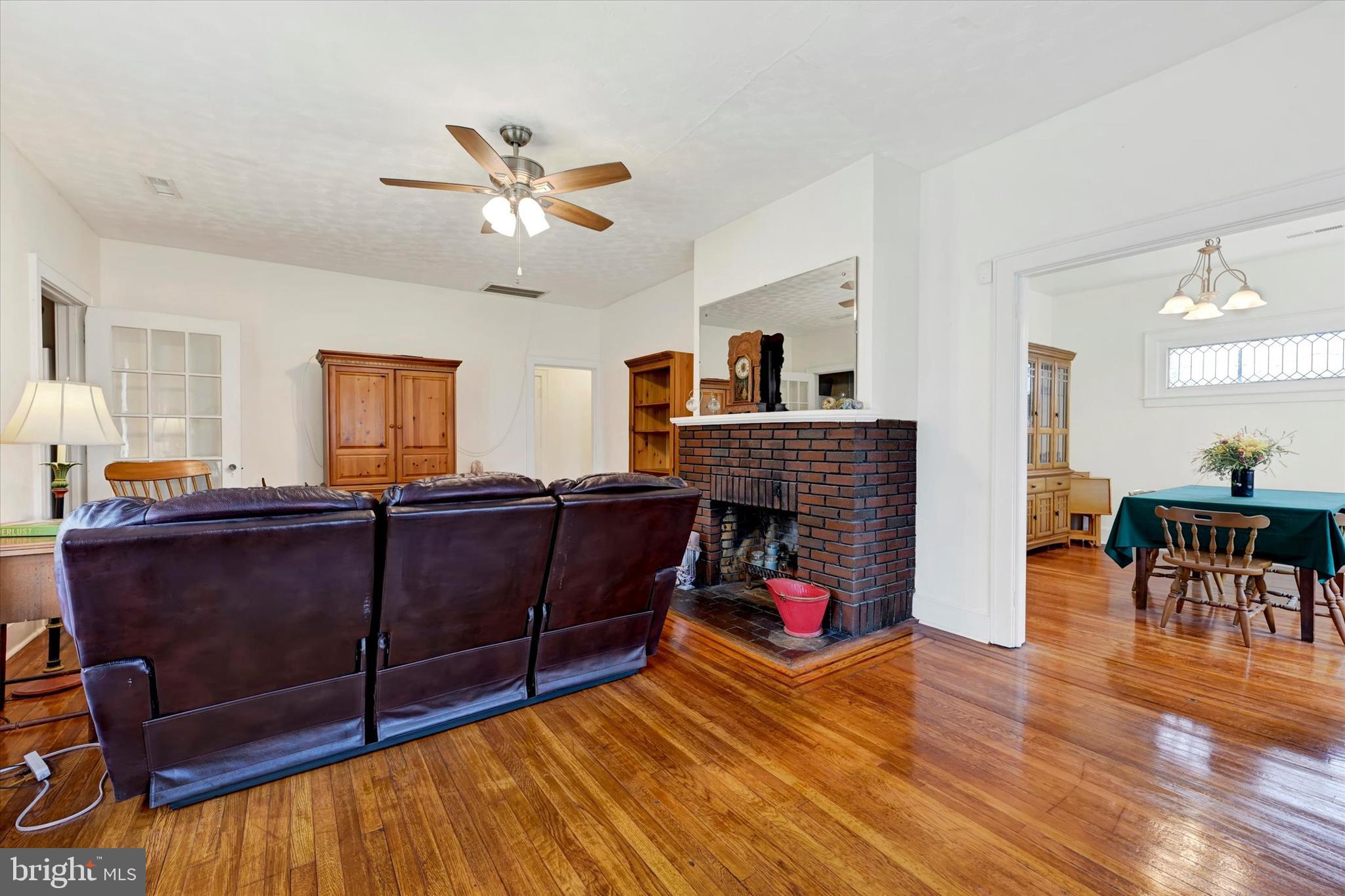 5 Liberty Parkway Baltimore, MD 21222 - Photo 13 of 31 a living room with furniture and a fireplace