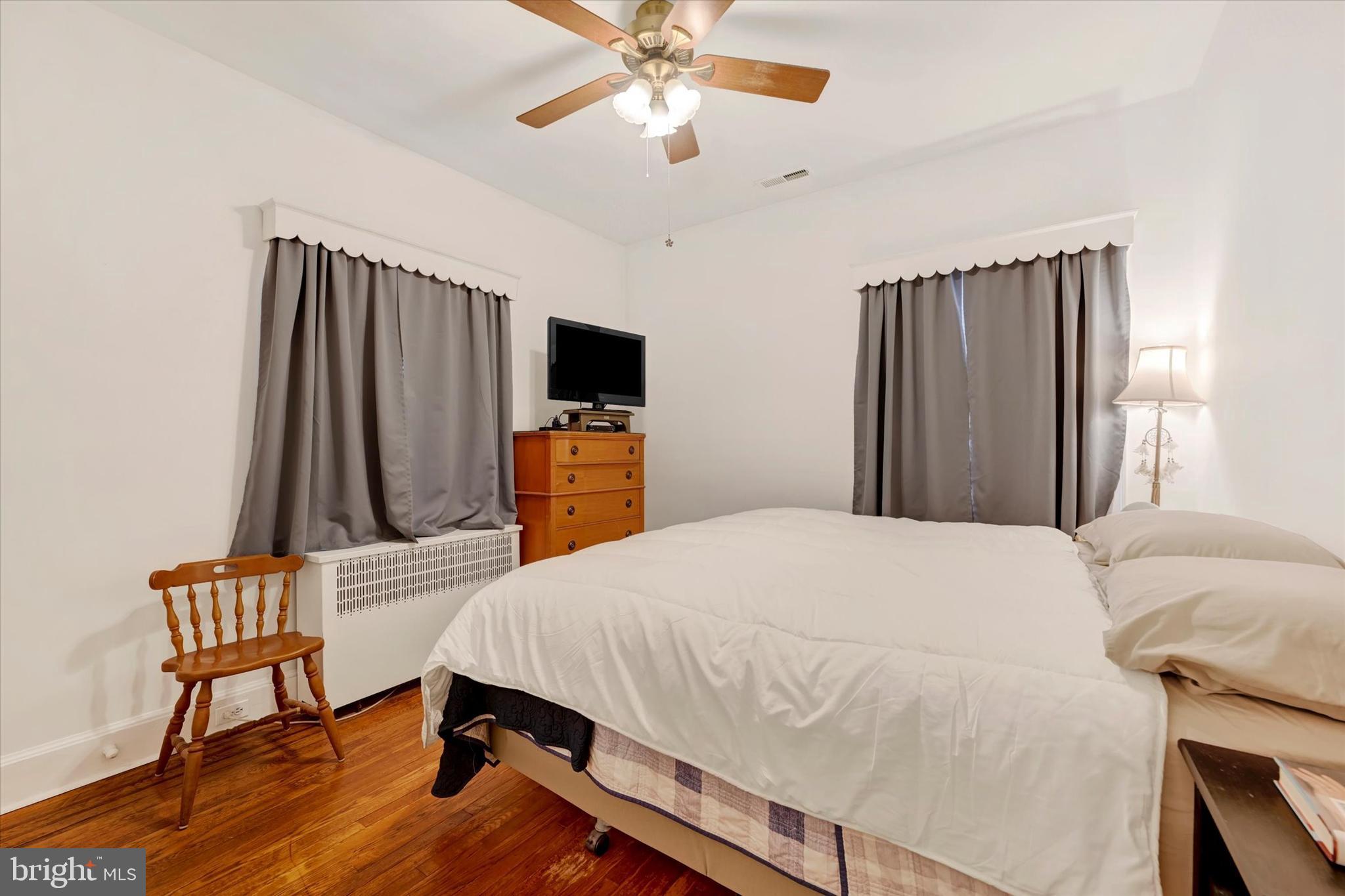 5 Liberty Parkway Baltimore, MD 21222 - Photo 19 of 31 a bedroom with a bed and a flat screen tv