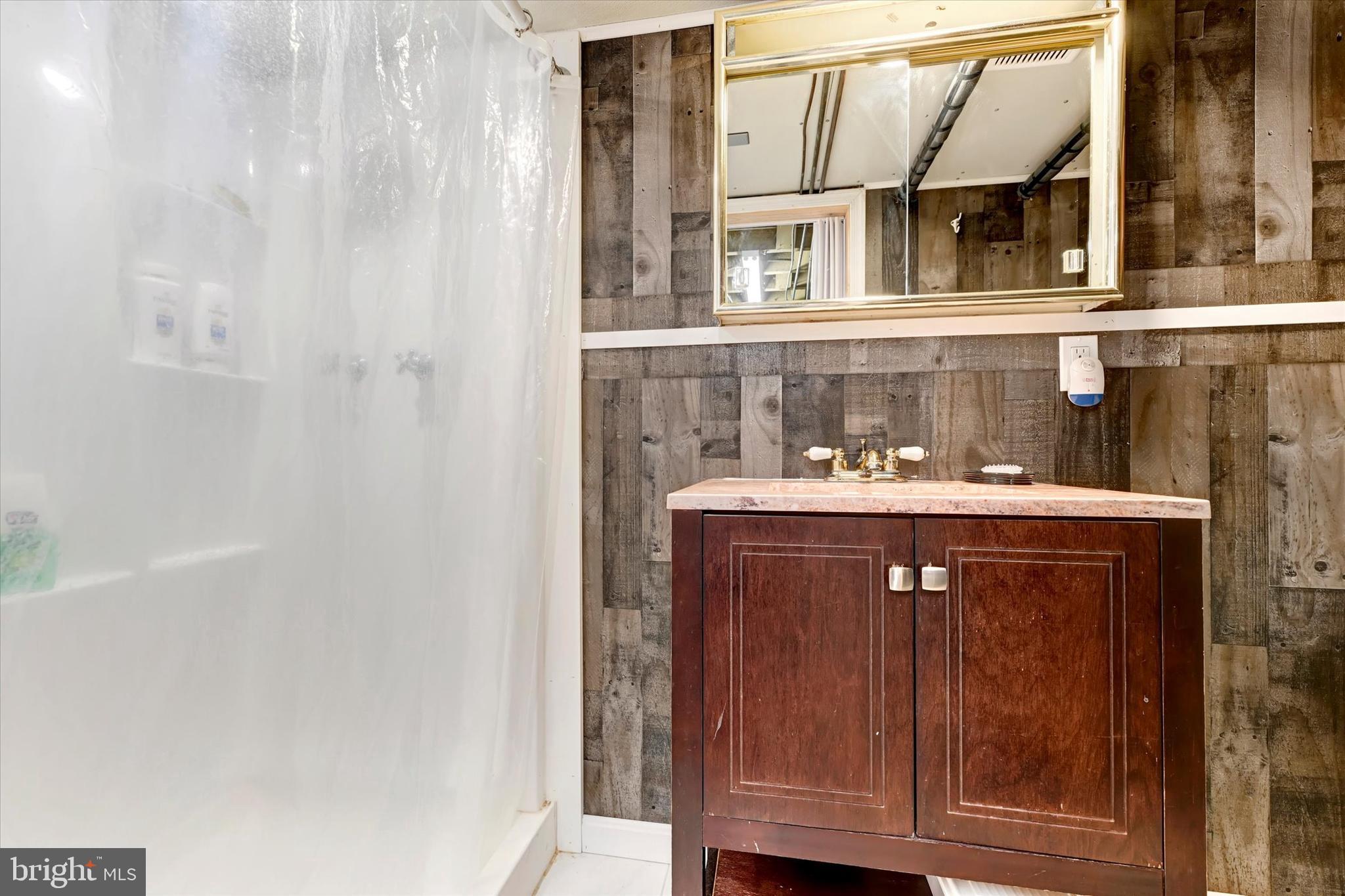 5 Liberty Parkway Baltimore, MD 21222 - Photo 21 of 31 a bathroom with a sink and a mirror
