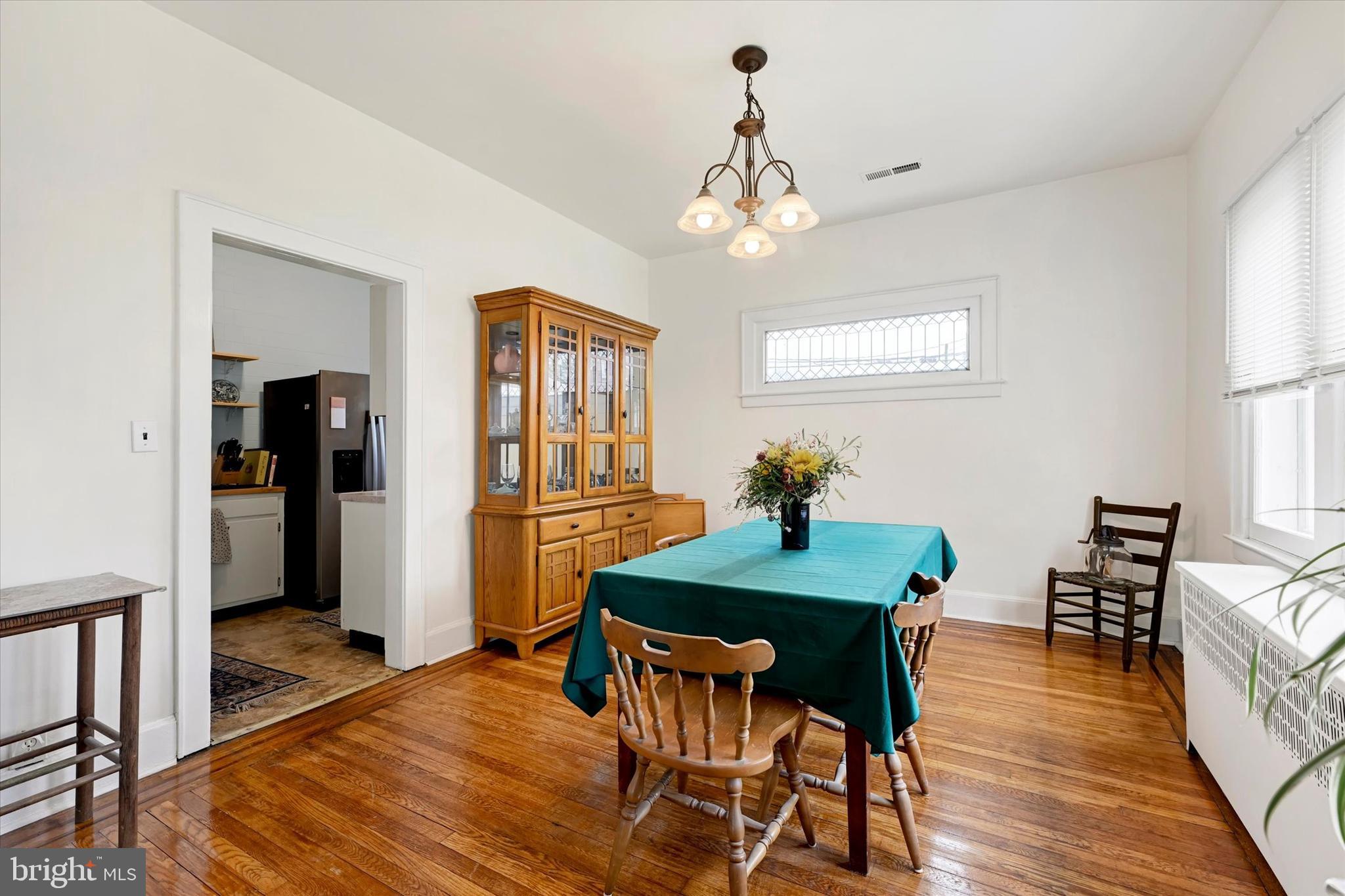 5 Liberty Parkway Baltimore, MD 21222 - Photo 7 of 31 a view of a dining room with furniture window and wooden floor
