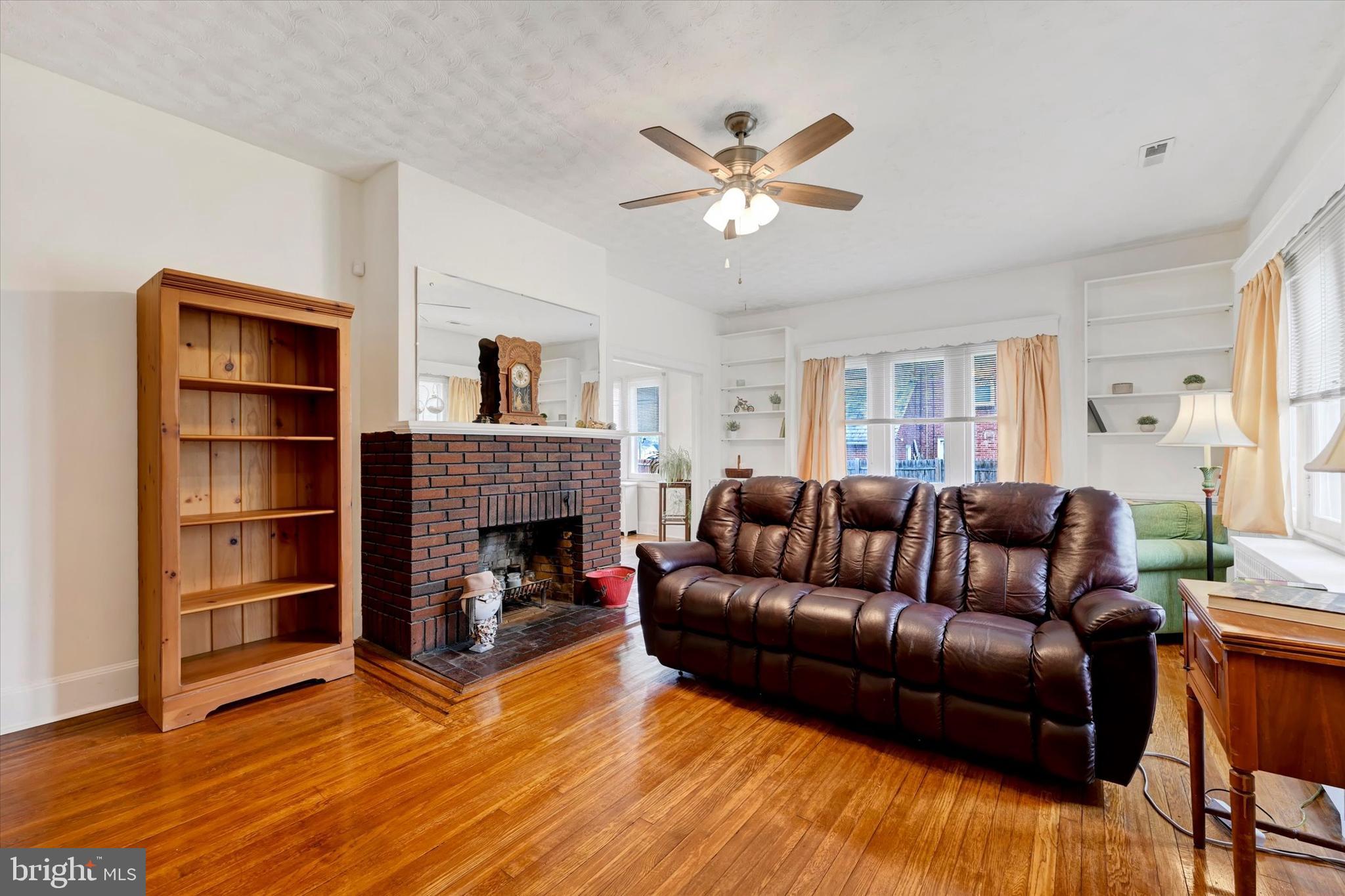 5 Liberty Parkway Baltimore, MD 21222 - Photo 10 of 31 a living room with furniture and a fireplace