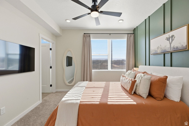 961 West Akoya Pearl Road, Unit 300 St. George, UT 84790 - Photo 29 of 60 Bedroom with light colored carpet and ceiling fan