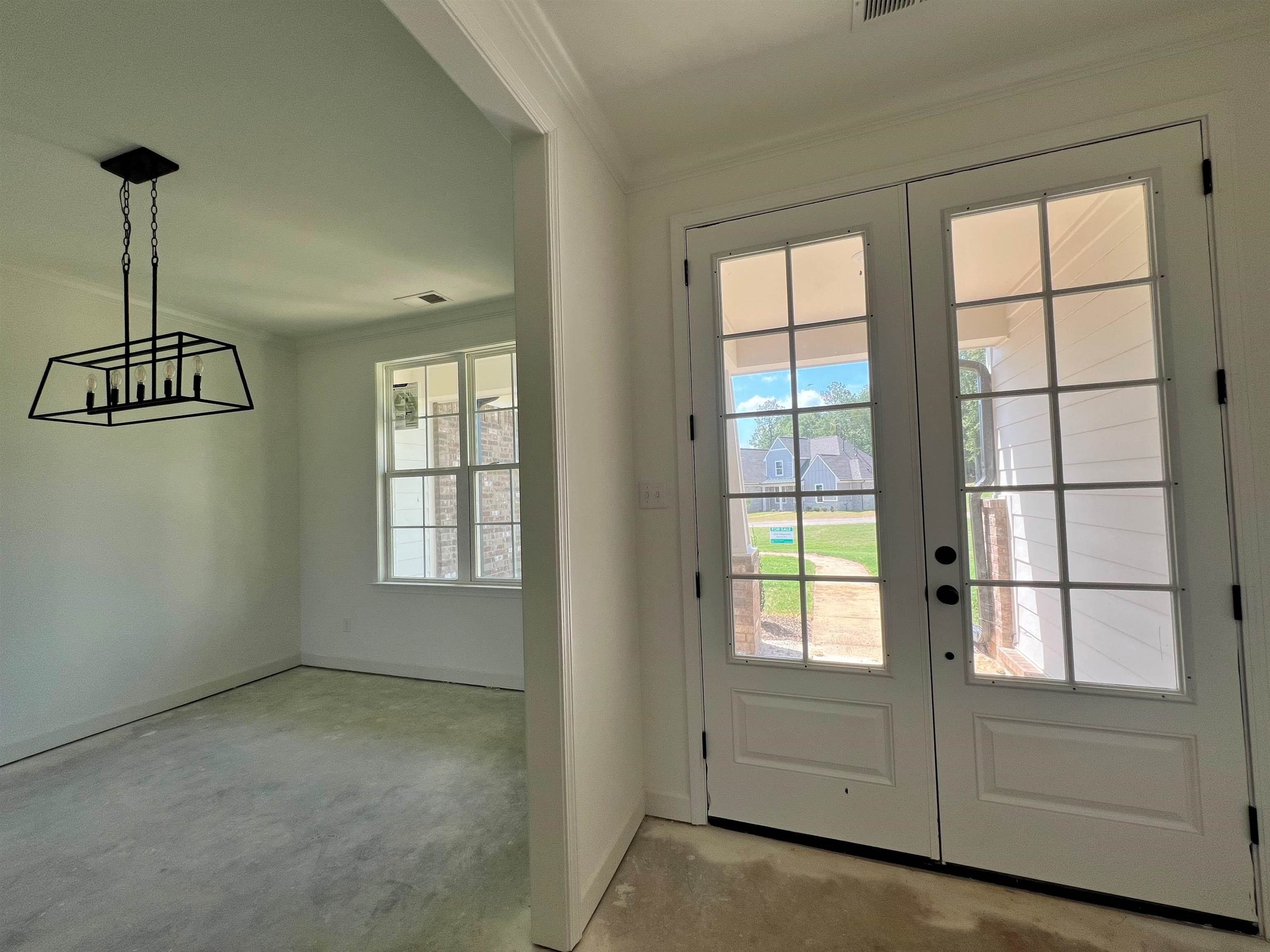 240 Drake Drive Collierville, TN 38017 - Photo 2 of 10 an empty room with windows