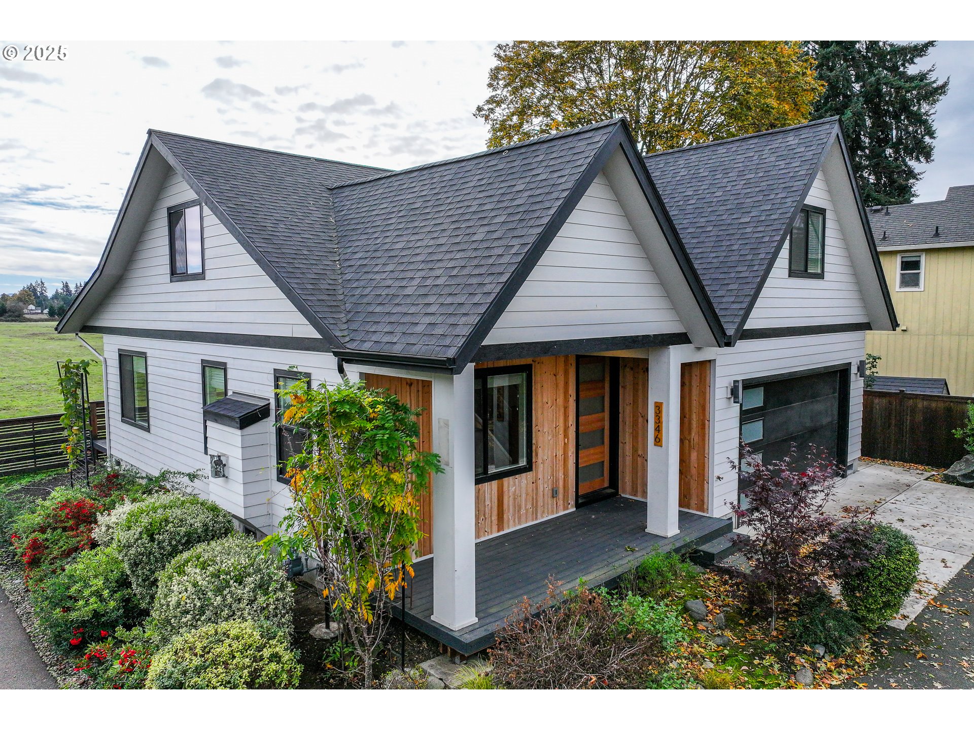 a aerial view of a house with table and chairs