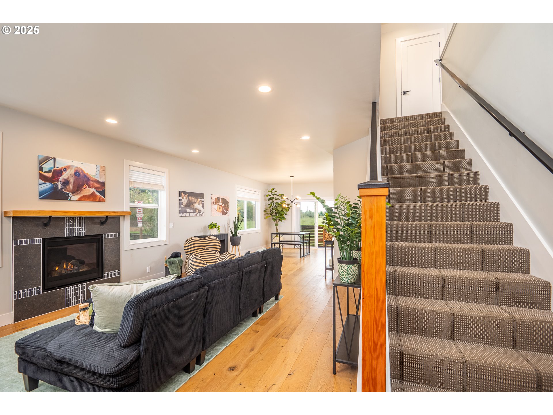 3346 Zane Lane Eugene, OR 97404 - Photo 18 of 47 a living room with furniture a fireplace and wooden floor