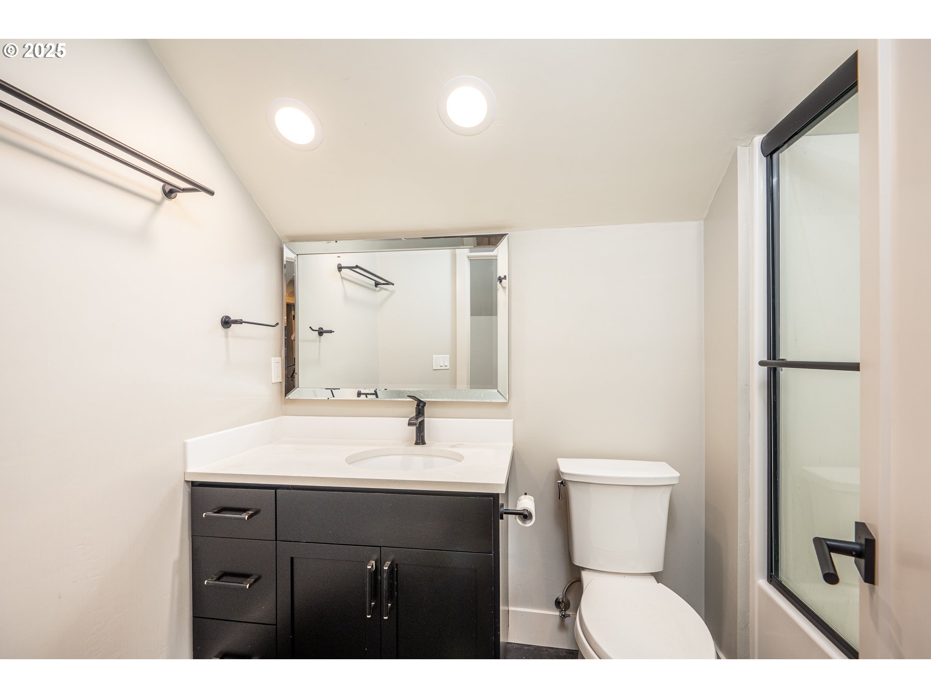 3346 Zane Lane Eugene, OR 97404 - Photo 21 of 47 a bathroom with a sink toilet a mirror and shower