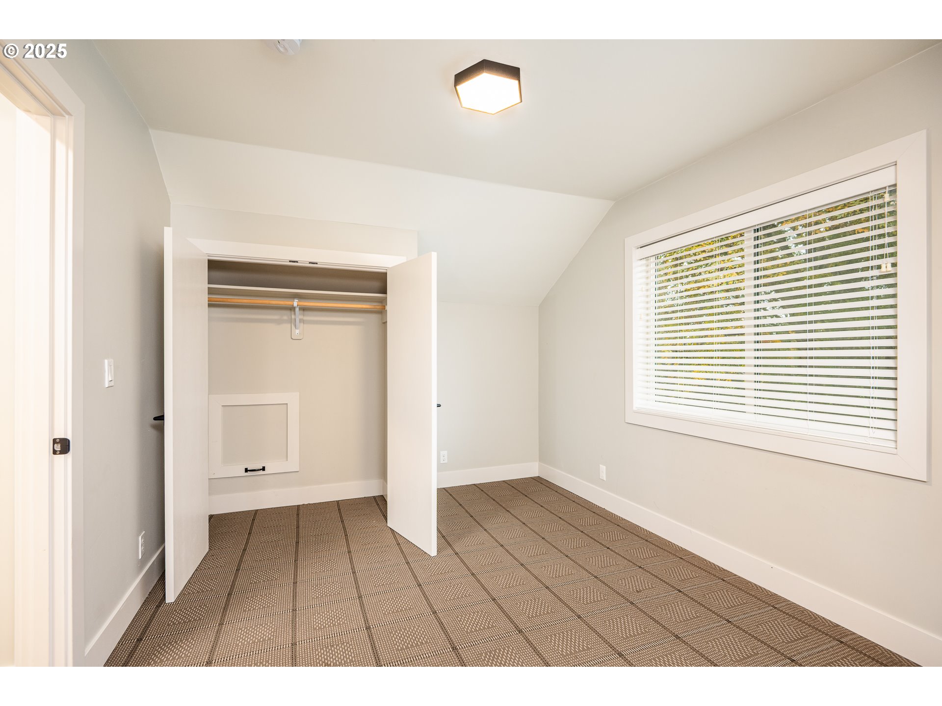 3346 Zane Lane Eugene, OR 97404 - Photo 23 of 47 a view of an empty room with wooden floor and a window