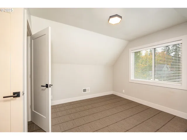 a view of wooden floor in an empty room