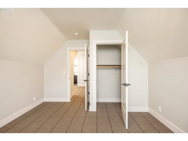 a view of balcony with hardwood floor and lake view