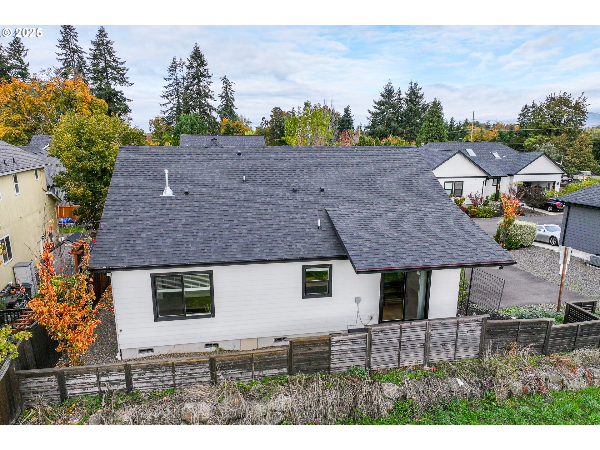 3346 Zane Lane Eugene, OR 97404 - Photo 32 of 47 a aerial view of a house with a yard and potted plants