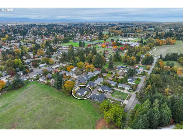an aerial view of a house with outdoor space