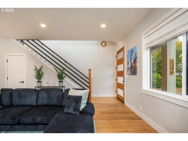 a view of an entryway with wooden floor