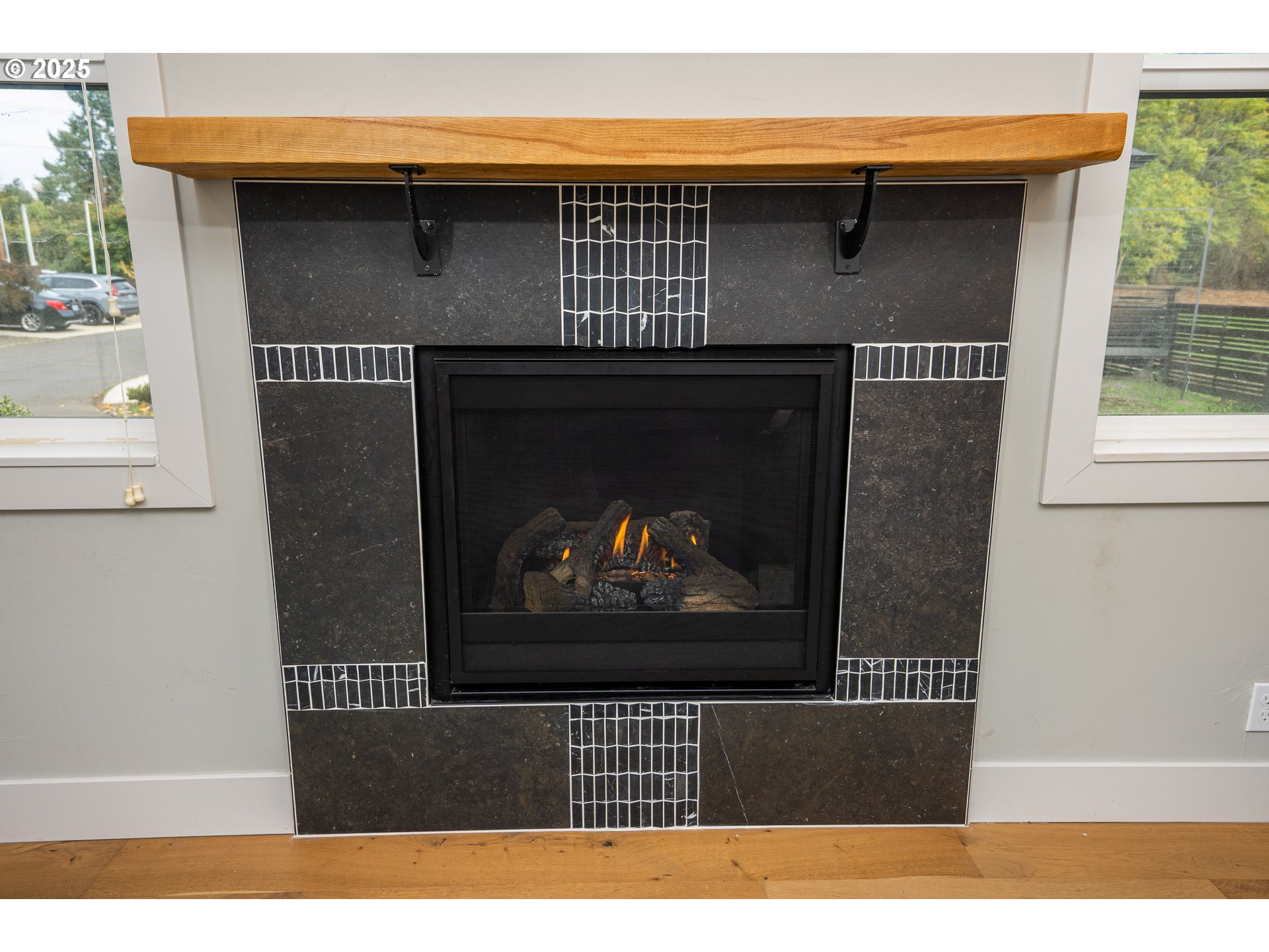 3346 Zane Lane Eugene, OR 97404 - Photo 5 of 47 a black and white photo of a fireplace