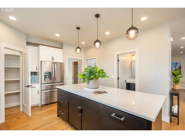 a kitchen with a refrigerator and countertop