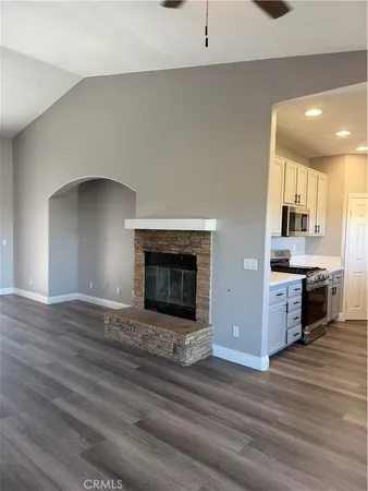 a kitchen with stainless steel appliances a stove top oven and cabinets