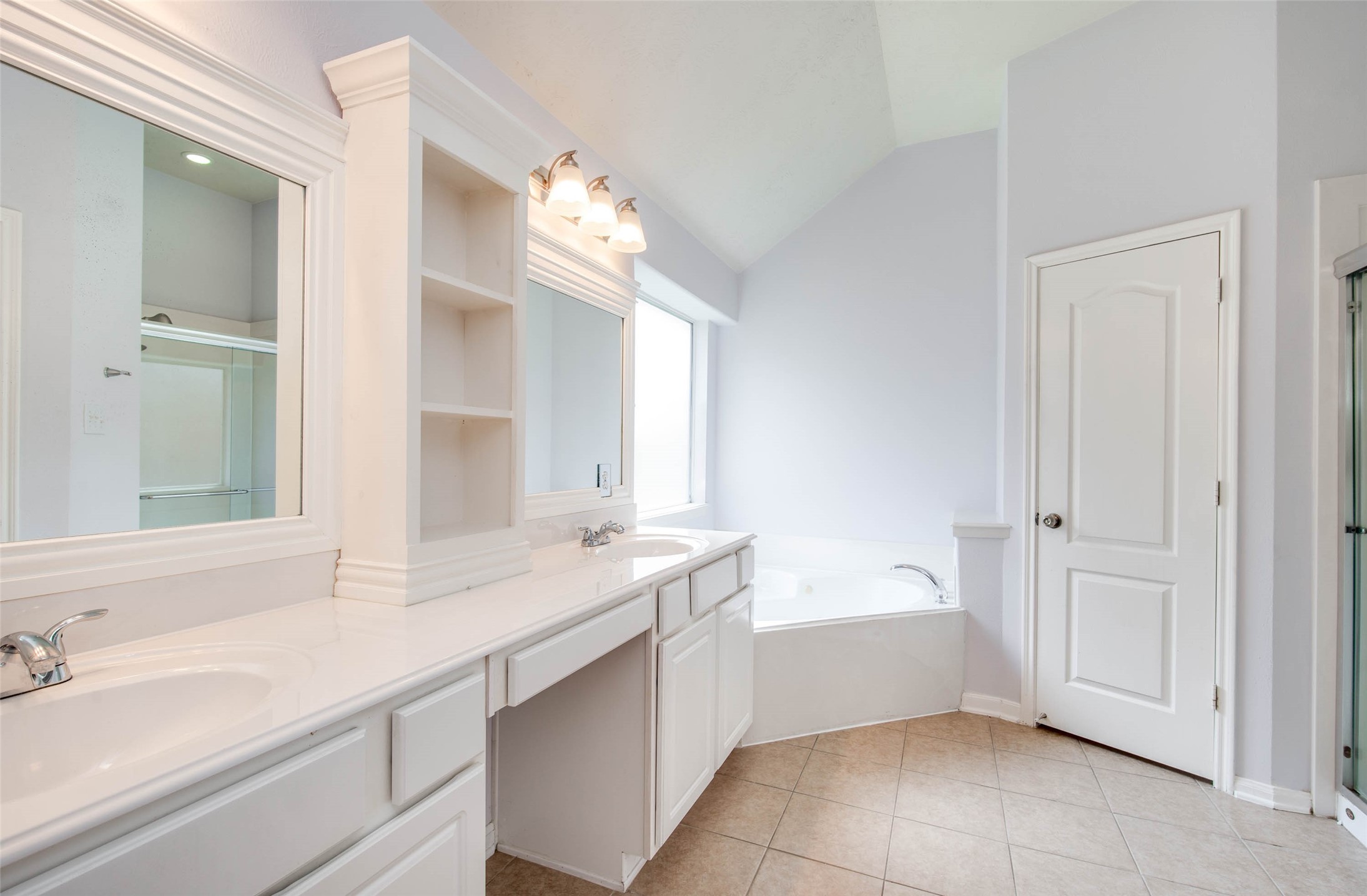 9323 Hillhaven Court Rosenberg, TX 77469 - Photo 25 of 37 a bathroom with a sink tub vanity and a mirror