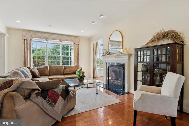 a kitchen with stainless steel appliances granite countertop a stove a sink dishwasher and a microwave oven with cabinets