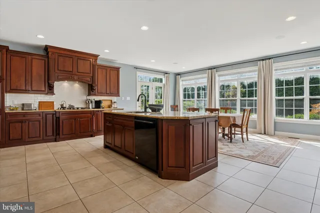 a living room with furniture and large windows